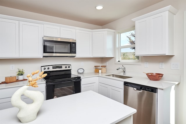 kitchen featuring white cabinets, sink, and stainless steel appliances