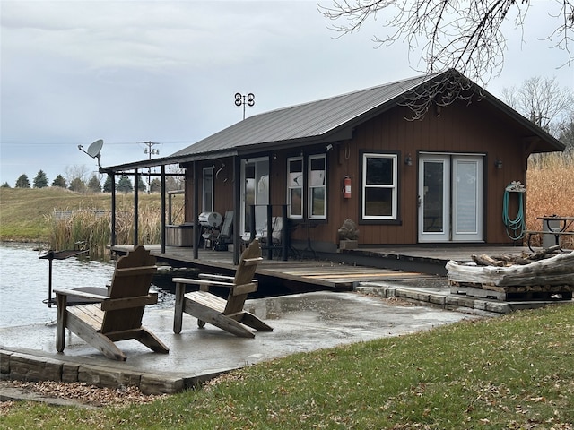 back of property with a water view