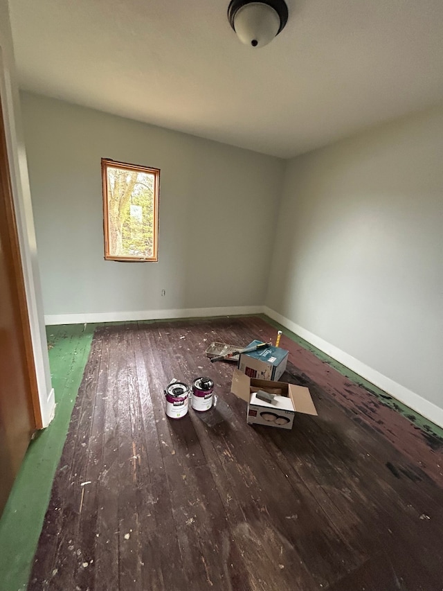 empty room featuring dark hardwood / wood-style flooring