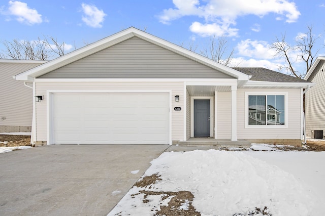 single story home featuring a shingled roof, driveway, and an attached garage