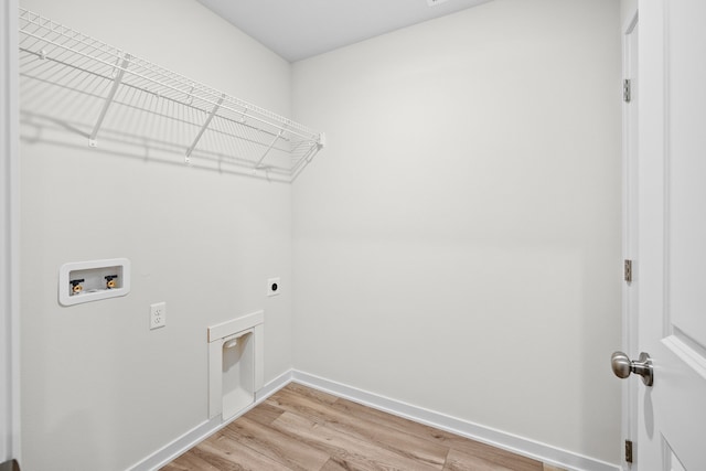 laundry area featuring washer hookup, light wood finished floors, hookup for an electric dryer, laundry area, and baseboards