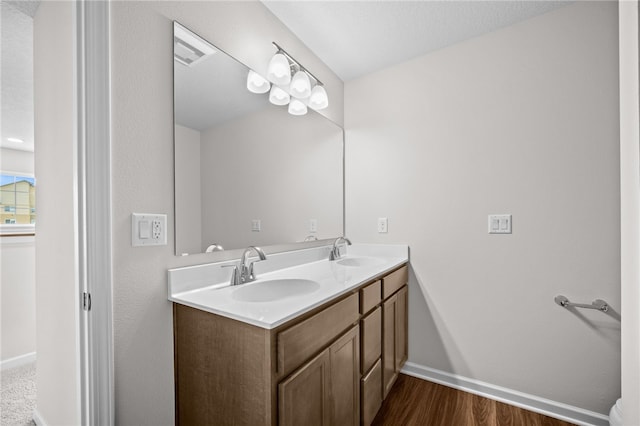 bathroom featuring vanity and wood-type flooring