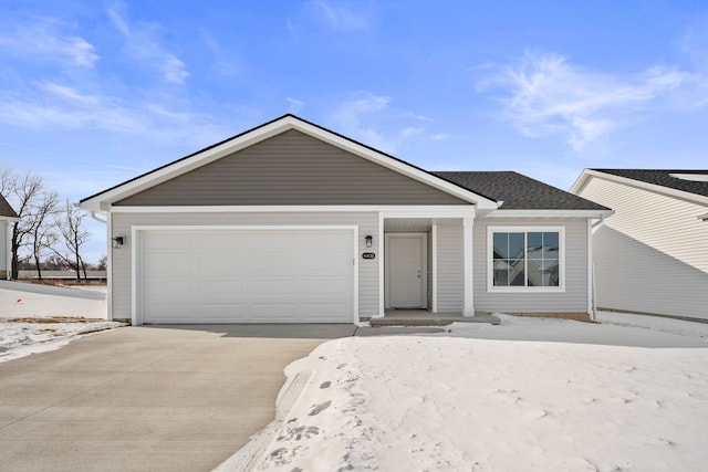 ranch-style house featuring an attached garage, concrete driveway, and roof with shingles