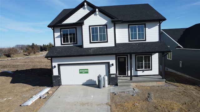 view of front of house featuring a garage and covered porch