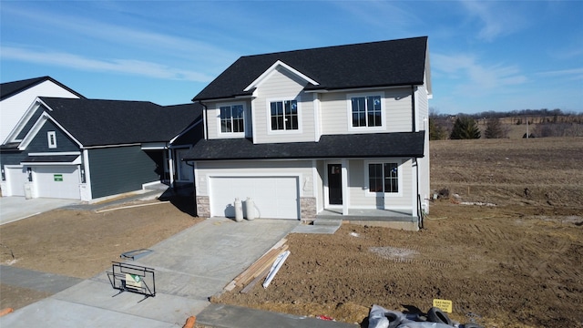 view of front facade with a garage and covered porch