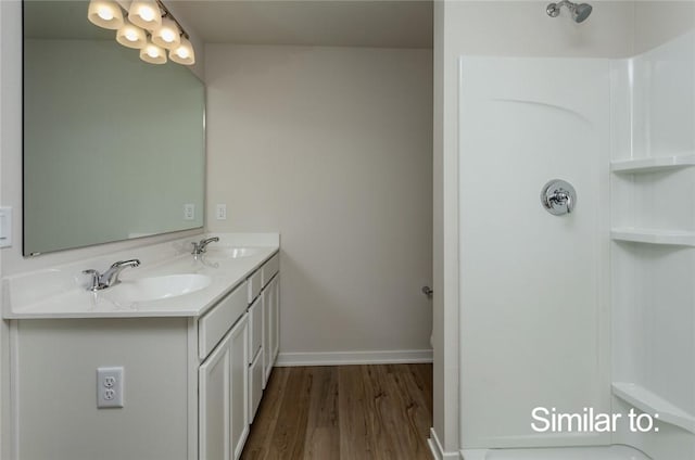 bathroom featuring vanity and hardwood / wood-style floors