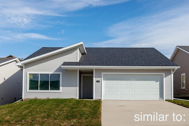 view of front facade with a garage and a front yard