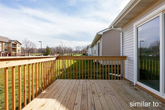 wooden deck with a yard