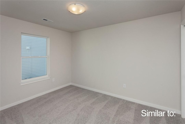 unfurnished room featuring carpet floors