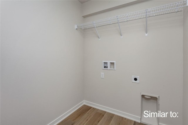 washroom featuring hardwood / wood-style flooring, washer hookup, and electric dryer hookup