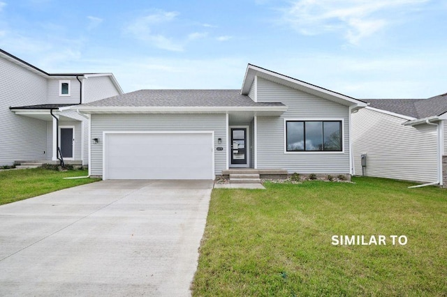 view of front facade featuring a garage and a front lawn