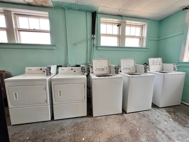 washroom with a healthy amount of sunlight and separate washer and dryer