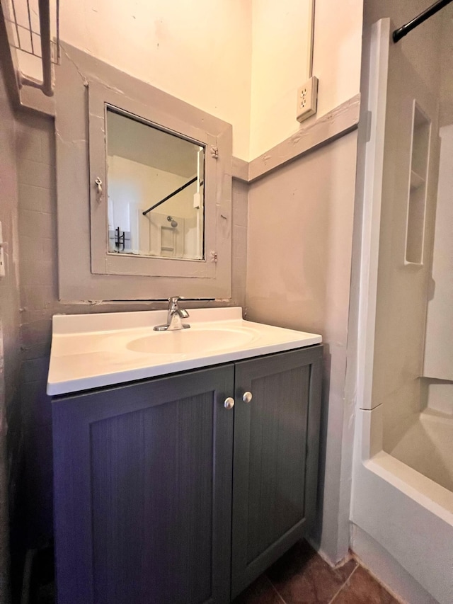 bathroom featuring vanity, shower / bath combination, and tile patterned flooring