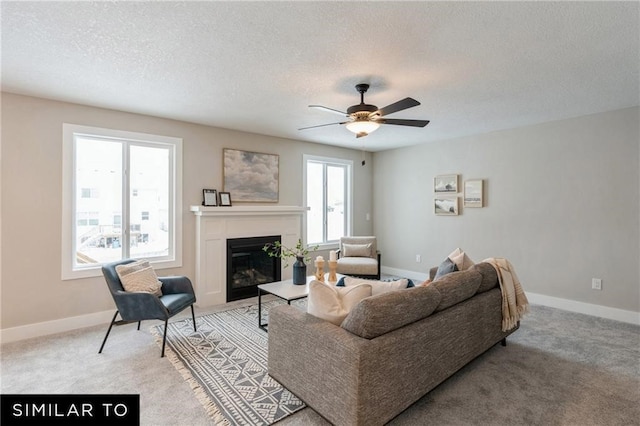 living room featuring light carpet, a textured ceiling, and ceiling fan