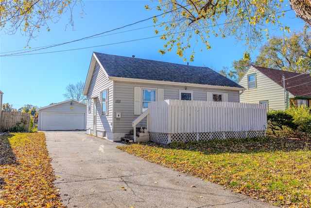 view of front of house featuring a garage and an outdoor structure