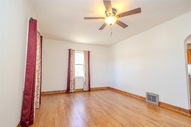 empty room with light hardwood / wood-style floors and ceiling fan