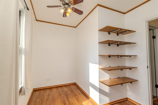 interior space with light wood-type flooring and crown molding