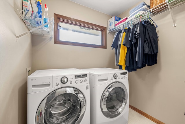 laundry room with washer and dryer