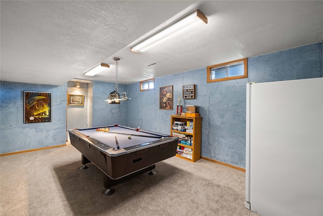 recreation room featuring a textured ceiling, pool table, and carpet