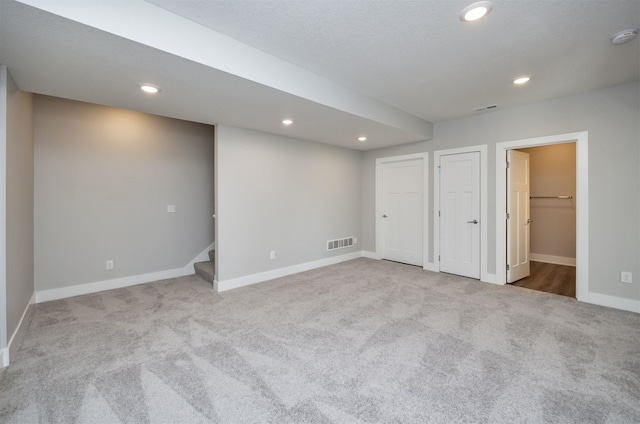 basement with light carpet