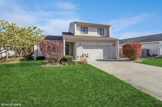 view of front property featuring a front lawn and a garage