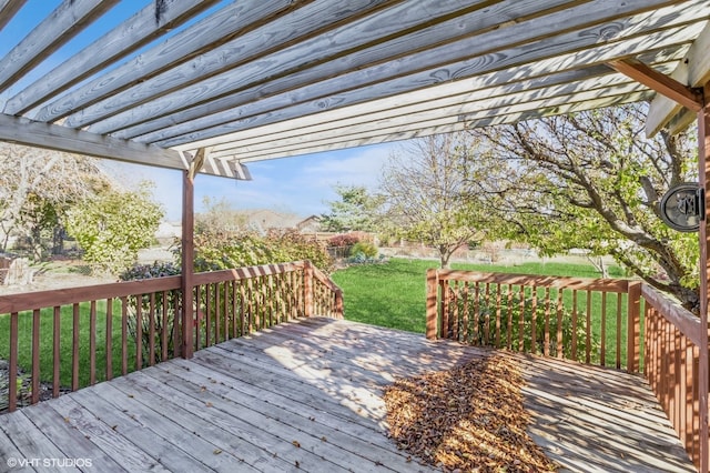 wooden deck with a pergola and a lawn