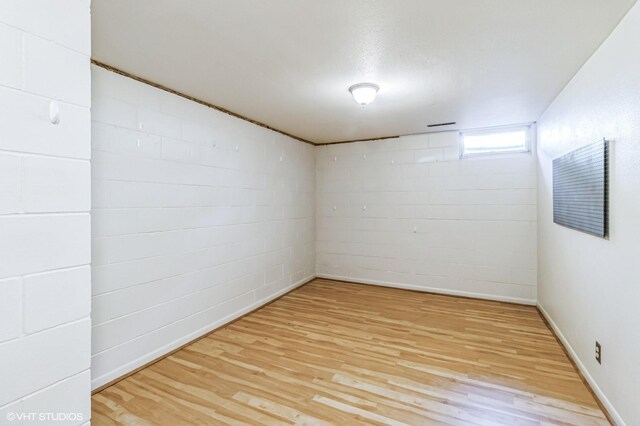 basement featuring light hardwood / wood-style flooring