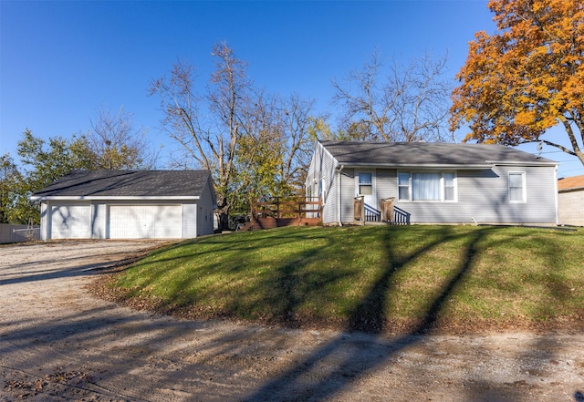 view of home's exterior featuring an outbuilding, a garage, and a lawn