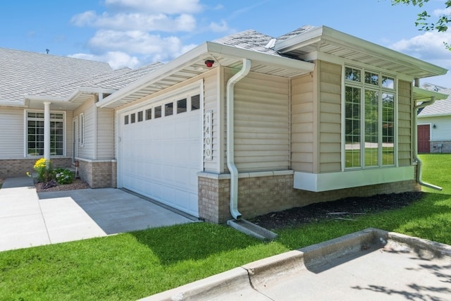 view of property exterior featuring a garage and concrete driveway