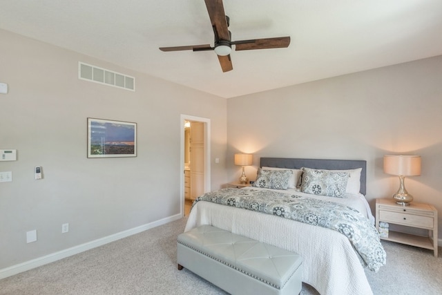 carpeted bedroom with baseboards, visible vents, and a ceiling fan