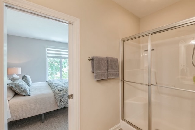 bathroom with a stall shower and ensuite bathroom