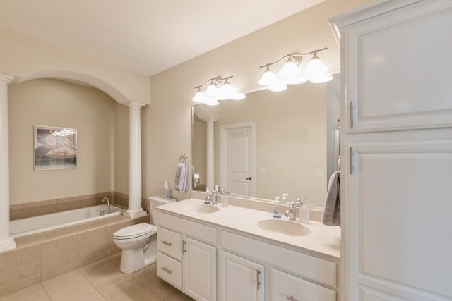 full bath with ornate columns, a sink, and tile patterned floors