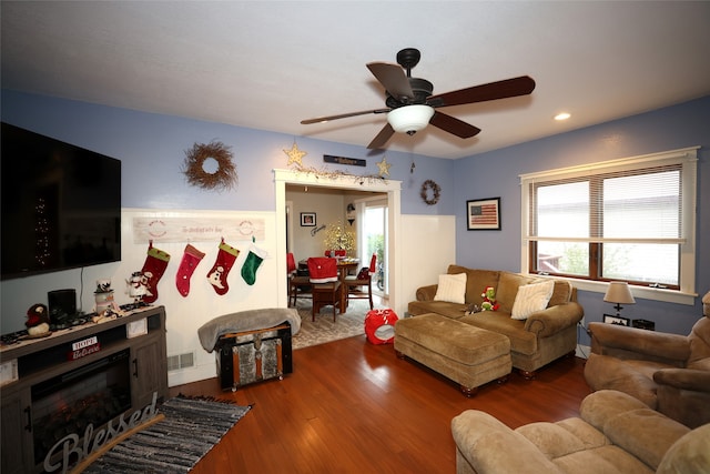 living room with hardwood / wood-style floors and ceiling fan