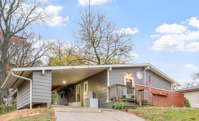 view of front facade with a carport