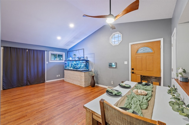 foyer with light wood-type flooring, ceiling fan, and lofted ceiling