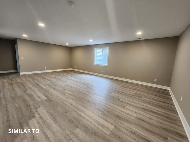 spare room featuring light hardwood / wood-style floors