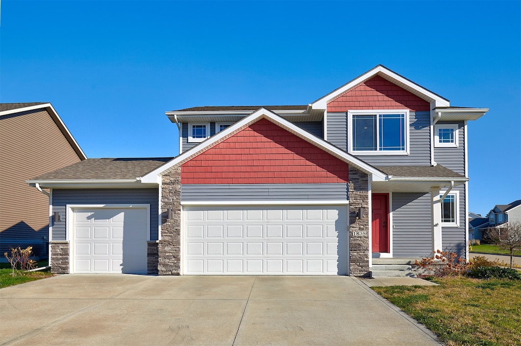 craftsman-style home with a garage