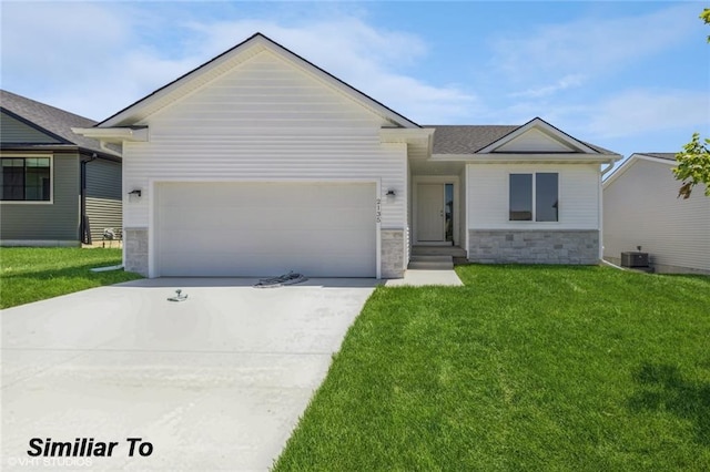 ranch-style home featuring a front lawn and a garage