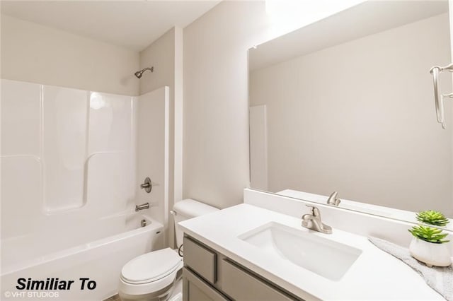 full bathroom featuring vanity, shower / bathing tub combination, and toilet