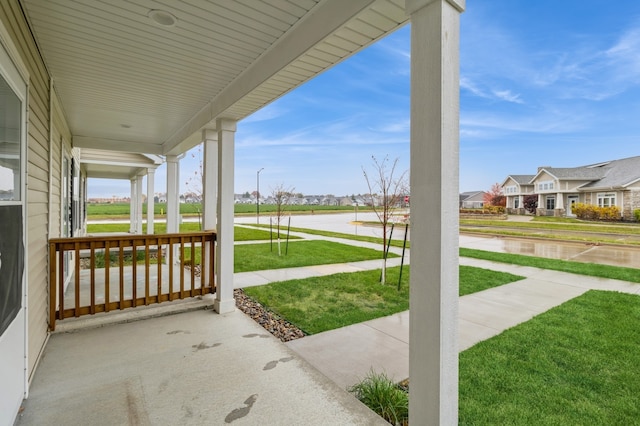 view of patio with a residential view and covered porch