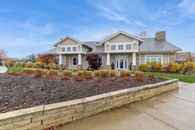 craftsman-style home featuring french doors