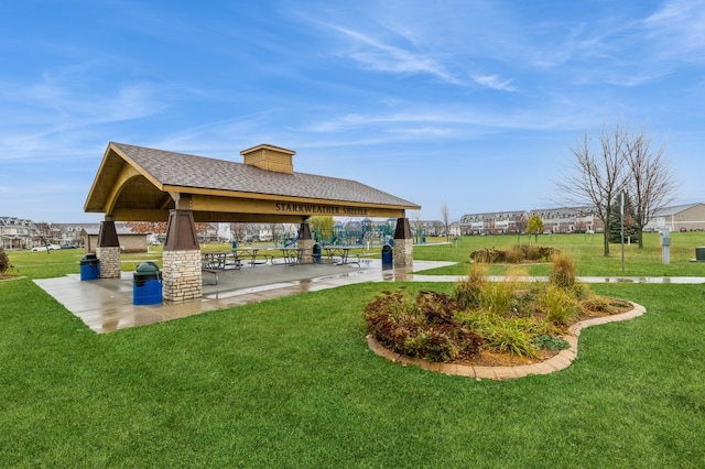 surrounding community with a gazebo and a lawn