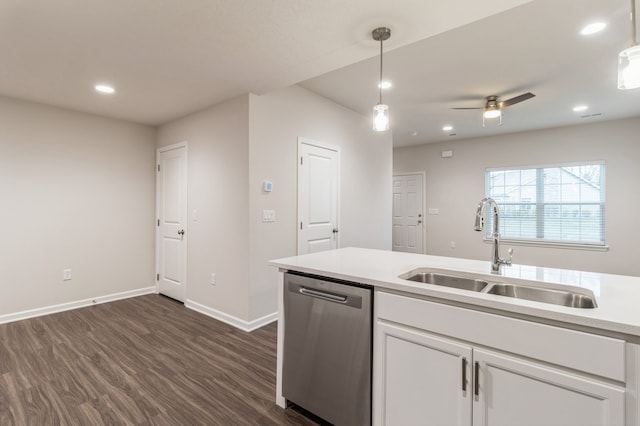 kitchen featuring dark wood-type flooring, a sink, white cabinetry, dishwasher, and pendant lighting