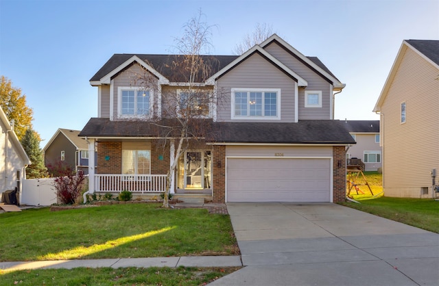 craftsman house with covered porch, a garage, and a front lawn