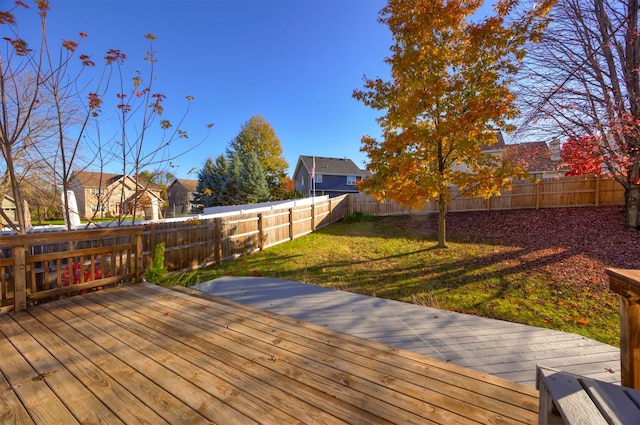 wooden deck with a lawn