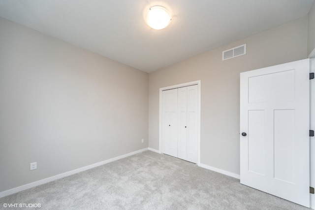 2806 22nd St SW, Altoona, IA 50009 - unfurnished bedroom featuring carpet flooring, baseboards, and a closet