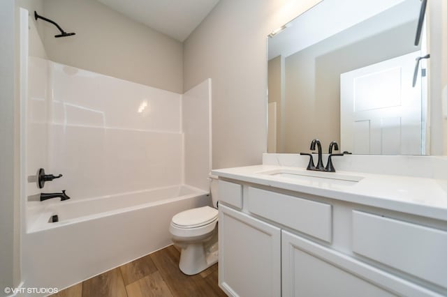 2806 22nd St SW, Altoona, IA 50009 - bathroom featuring wood finished floors, toilet, shower / bathtub combination, and vanity