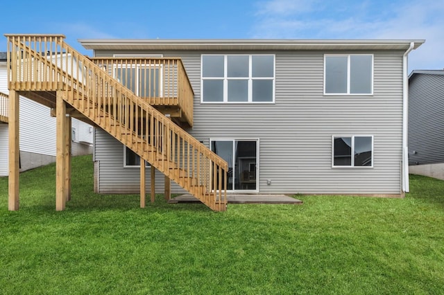 2806 22nd St SW, Altoona, IA 50009 - back of house with stairs, a deck, and a lawn