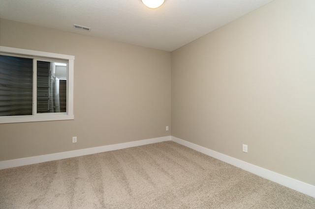 spare room with carpet floors