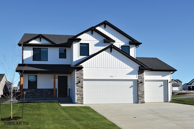 view of front of home featuring a front lawn and a garage